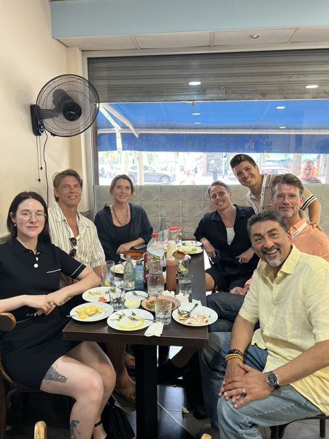 Tam at dinner with colleagues in Barcelona